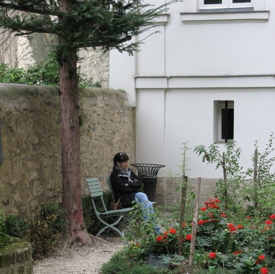 Dianne Warren - Woman sitting in a garden