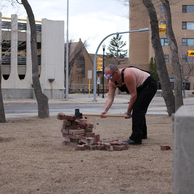 Jaye Kovach - Trans-woman smashing bricks in a park