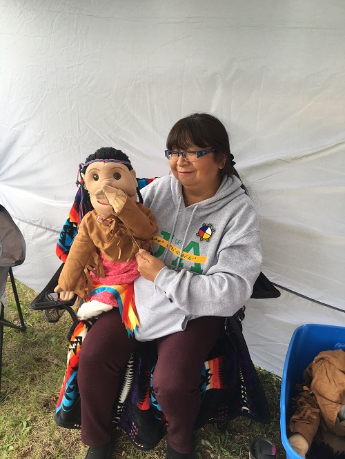 SKArts - A participant learns puppetry at the camp.