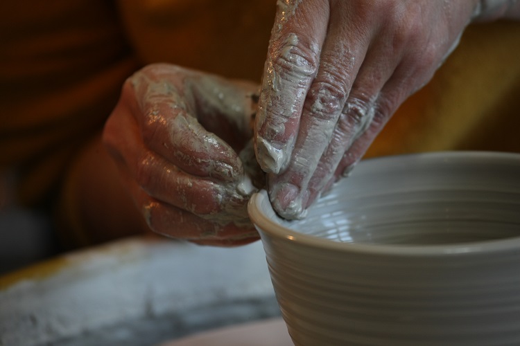 SKArts - Elaine Angelski works her craft at a pottery wheel.