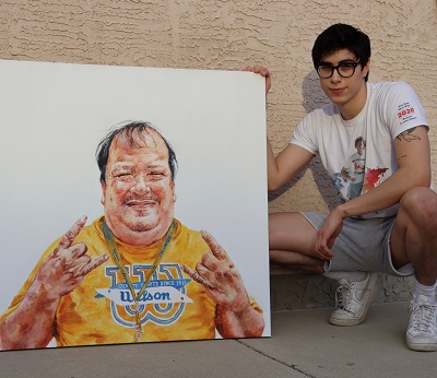 Zachary Lavallee next to his portrait of Dougie