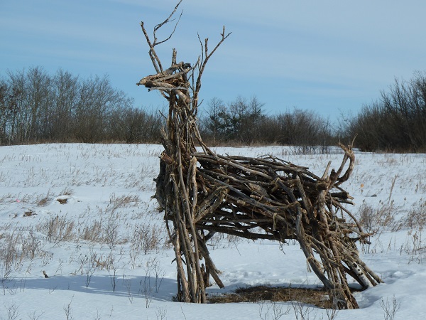 A deer sculpture made of deadfall wood.