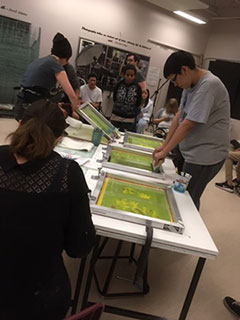 Students engage in the printmaking processes they learned from Michael Peterson