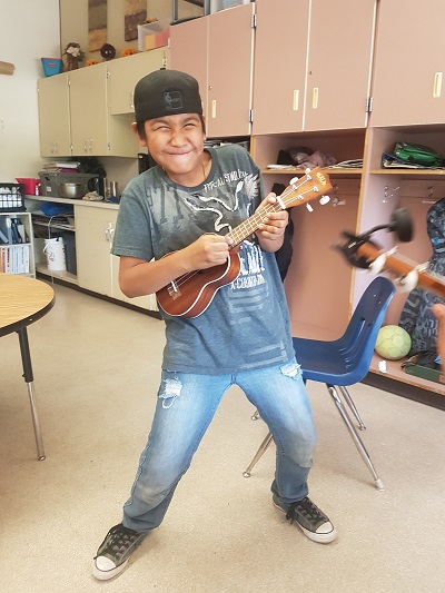 A student enjoys the instrument