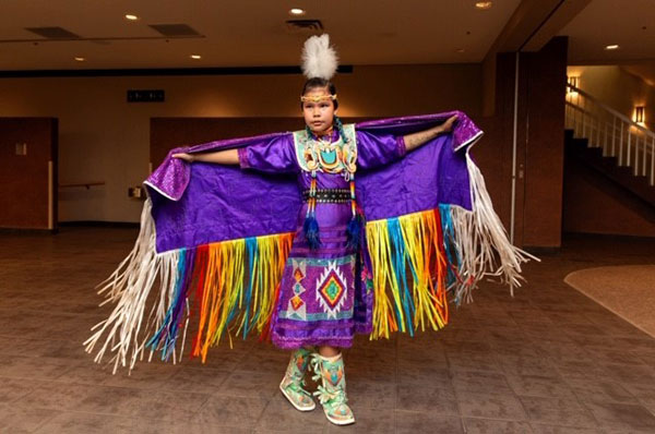 Thunderchild and Candline's daughter, Haedyn, dancing in regalia created by Candline