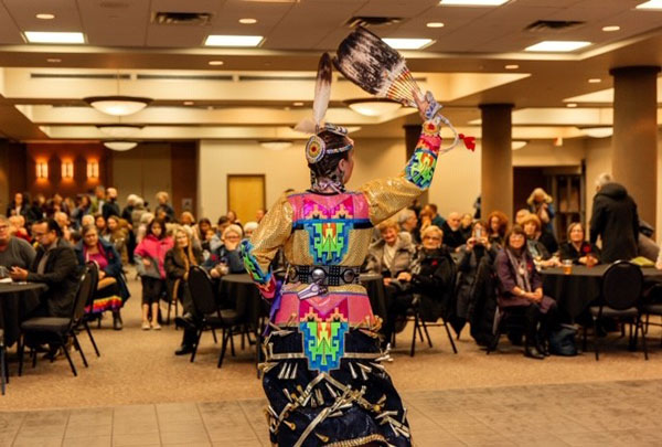Randi Candline performs a Jingle Dress Dance