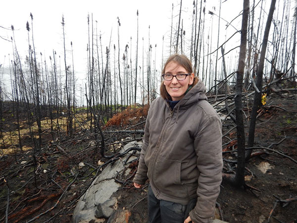 Miriam Körner near her burnt cabin three month after a wildfire