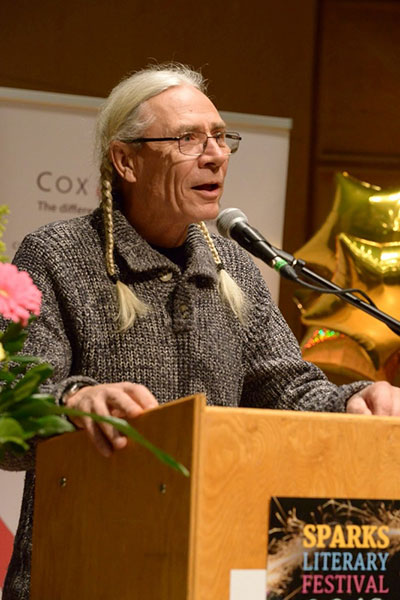 Harold Johnson speaks at a community event in La Ronge